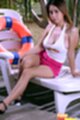 Busty Fone strips pink shorts and spreads her legs on lounger