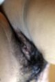 Fon stripping bra and panties and showing off her hairy pussy